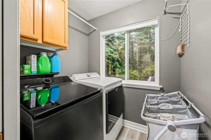 Laundry room w/ full size washer and dryer, lower level