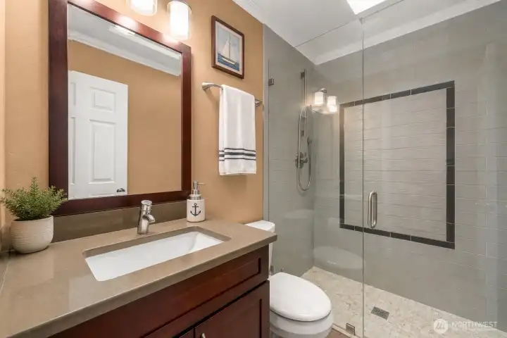 Guest bathroom 2 upper with shower  *virtually staged
