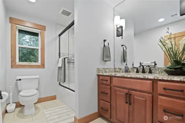 Upstairs Bathroom comes with heated floors and towel bars.