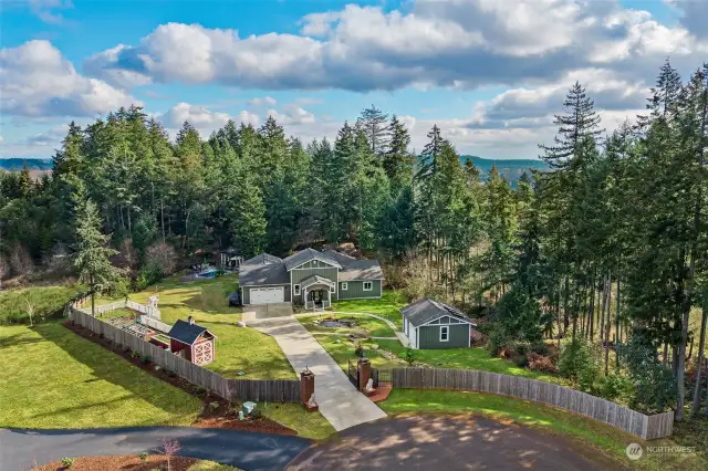 Another building to the right on the property is another 1-car garage outbuilding, which has heat and a roughed-in bathroom.