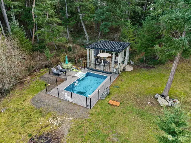 Your second pool is just off of the pergola and pillar outdoor living space, with 12’x20’ of pool fun with 4’ deep on shallow and 6’ deep on the other end. Fully fenced with a taller 6’ fence on the one side to keep any pool toys from ending up in the pergola area.