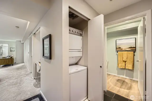 Entryway with slate floors, entry closet, and larger storage closet plus n unit laundry