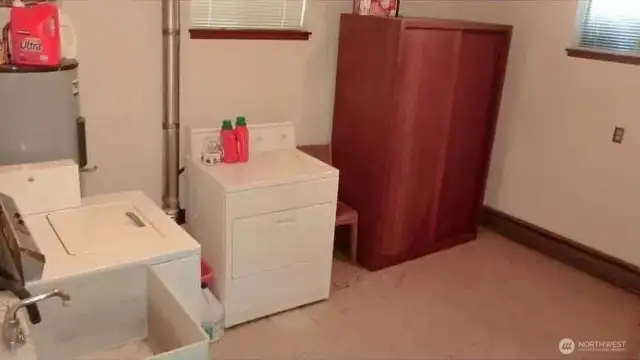 One of two community laundry rooms which could be converted to living space.