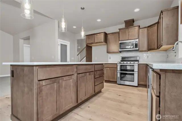 Plenty of storage in these beautiful maple cabinets