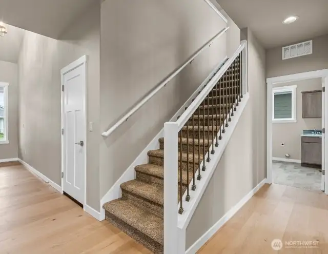 high end finishes like wood and metal railing on stairway