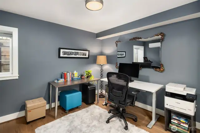 The lower level includes an additional bedroom suite, ideal for guests or as a versatile flex space.