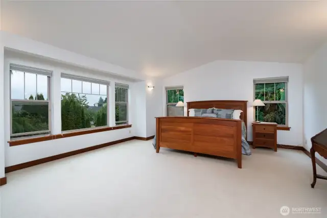 Spacious primary suite with large windows