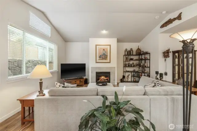 Great room style with living area next to dining and kitchen.