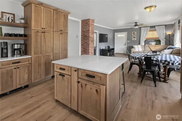 Functional island with quartz top & extra storage! Double toe kick drawers underneath too!