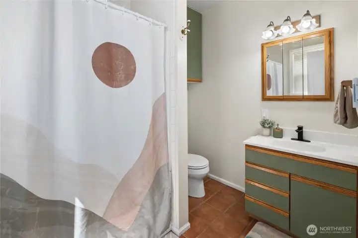 Main floor full bath! New thermostats throughout for all the electric wall heat.