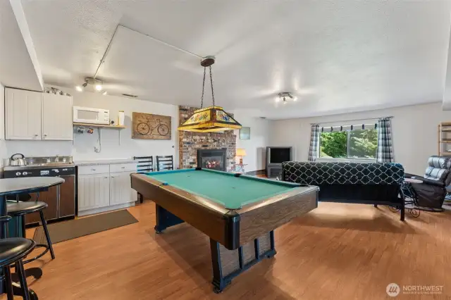 Love the lower-level rec room! Check out the kitchenette. Stove, sink, fridge, microwave & cabinets! Keep it as is or perhaps enhance it for a more formal ADU / Mother In Law.