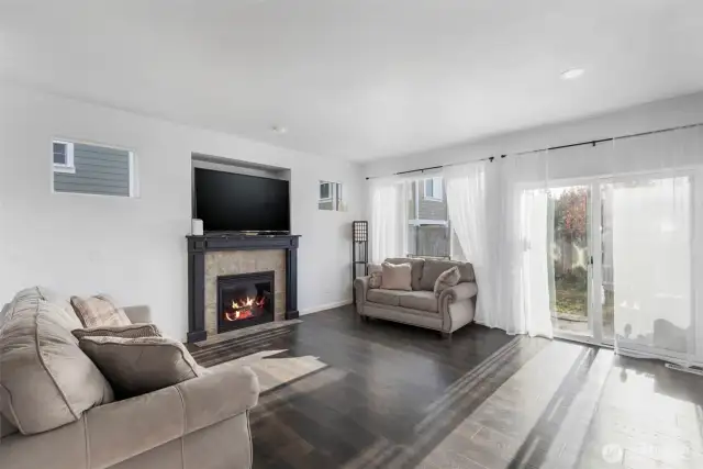 Gas fireplace with 60" TV niche.  Lots of windows for natural lighting.