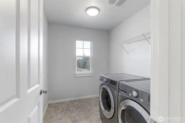 Spacious upstairs utility room.  Washer and dryer included.