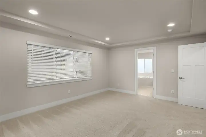 primary room leading into primary attached bath