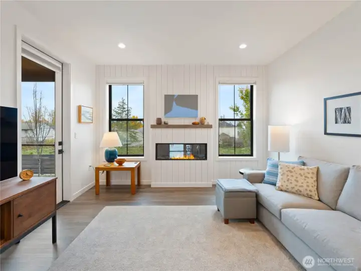 The living space overlooks the private backyard space.