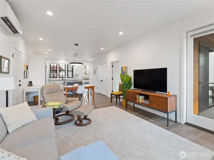 Glass side door opens to the private deck overlooking the pond.