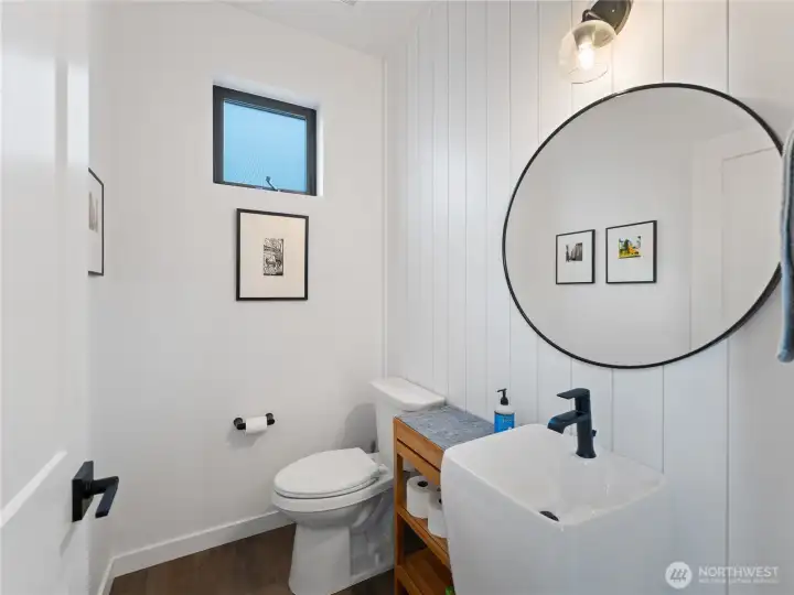Main floor powder room with shiplap detailing.