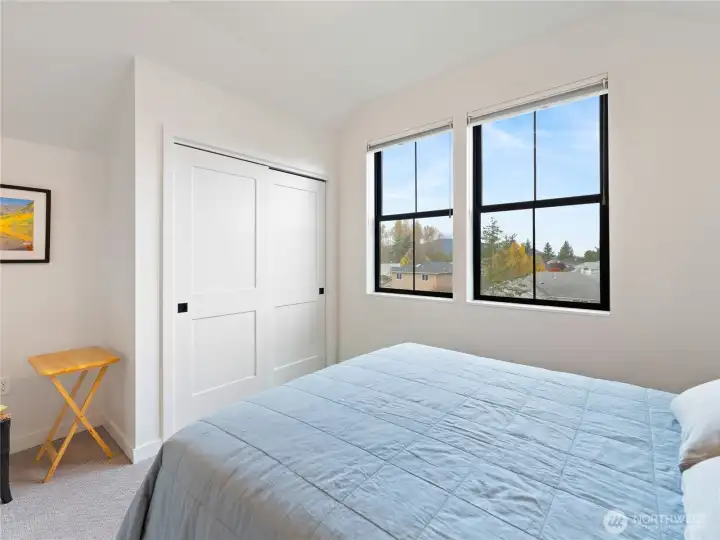 Upstairs bedroom closet and views out to the pond.