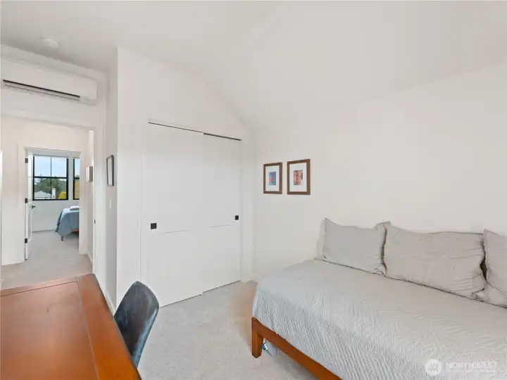 Additional upstairs bedroom looking out to the hallway.