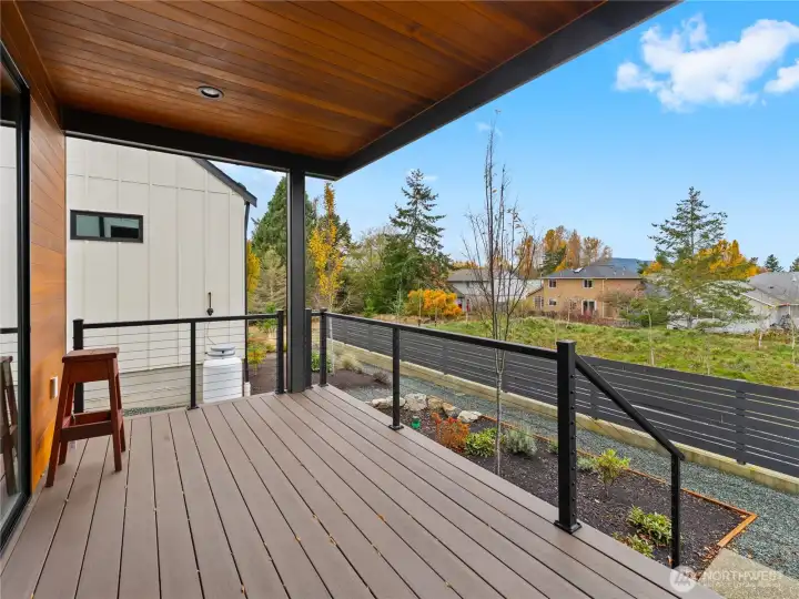 Private back deck overlooking the pond.