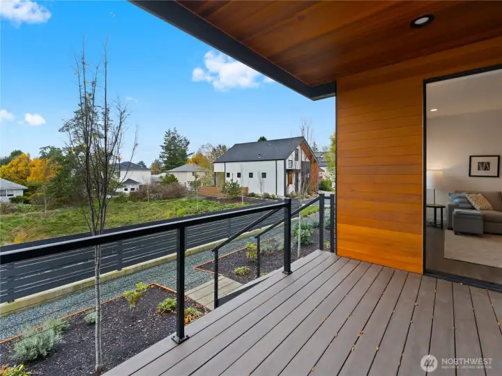 Private deck is wrapped in clear cedar and offers a wonderful spot to sit undercover and enjoy the views.