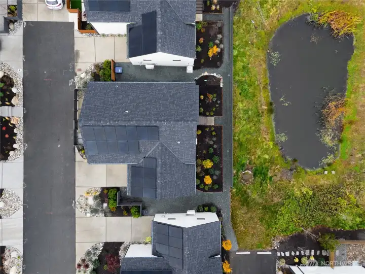 View looking down on the cottage and pond.