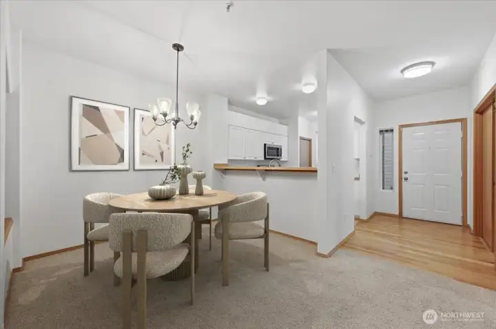 Dining, Kitchen and Entry.  Virtually staged.