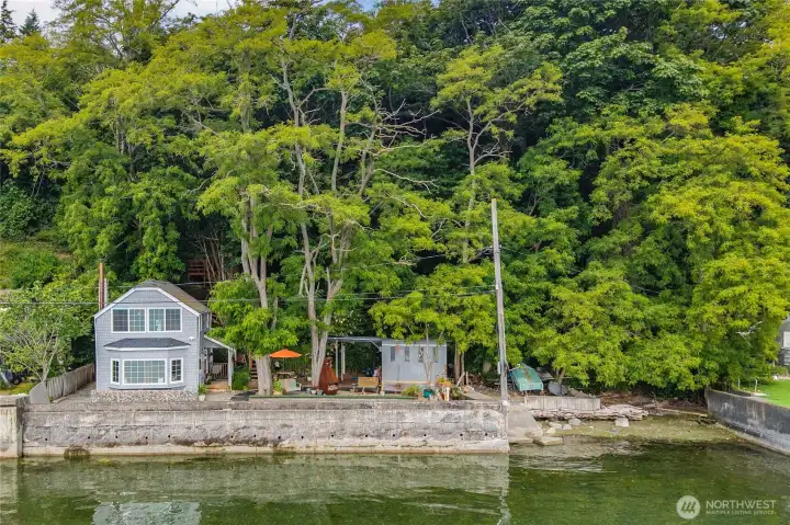 See how the home sits perfectly along the shoreline