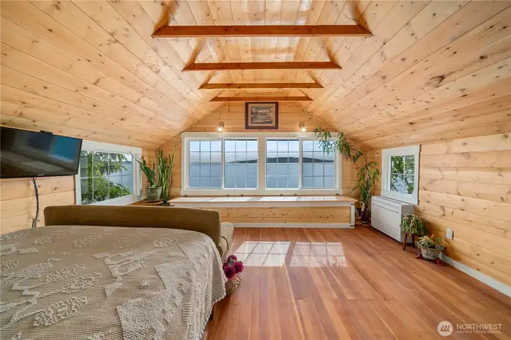 Upstairs retreat with vaulted ceilings and natural light.