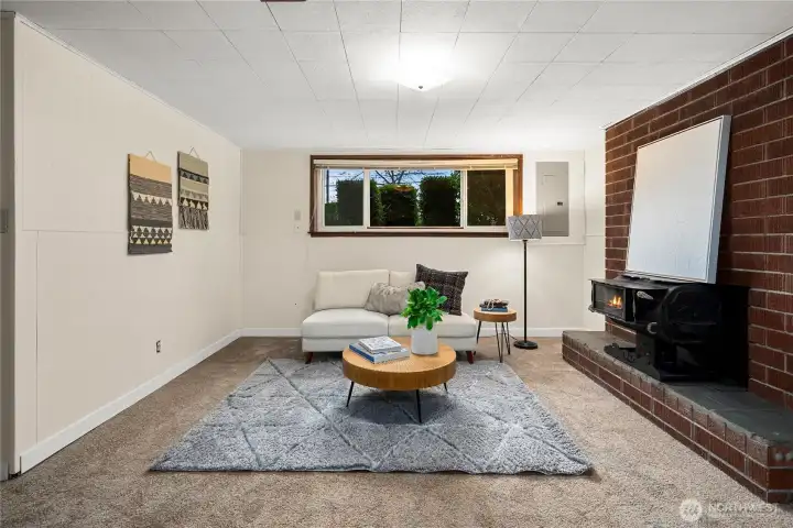 Generous family room with a cozy woodstove—perfect for relaxing.