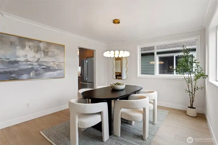 The dining room connects to both the kitchen and living room for easy entertaining.