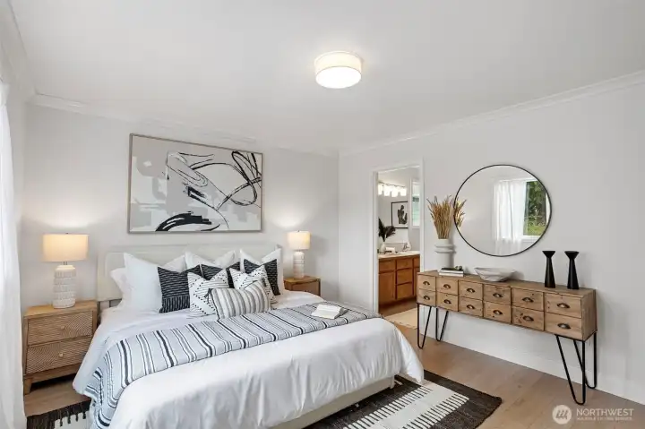 The Primary Suite features new luxury vinyl plank that runs through the ensuite bath and walk-in closet.