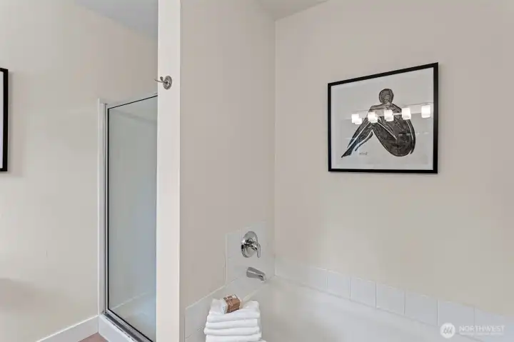 The primary en-suite bath features a large soaking tub and separate shower, it boasts an extra long vanity with 2 sinks.