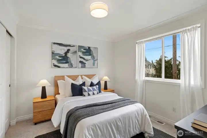 2nd upper level bedroom with new wall-to-wall carpeting and lighting.