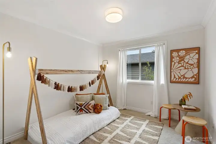 3rd upper level bedroom with new wall-to-wall carpeting and lighting.