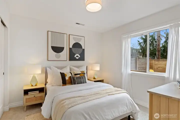 4th lower level bedroom features new wall-to-wall carpeting and lighting.