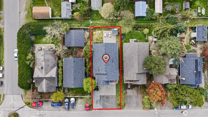 Overhead shot of house, yard and front parking.