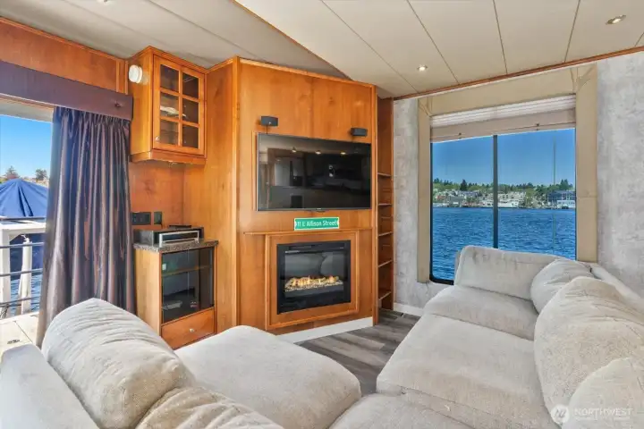 View towards the lake off lower deck, and electric fireplace.