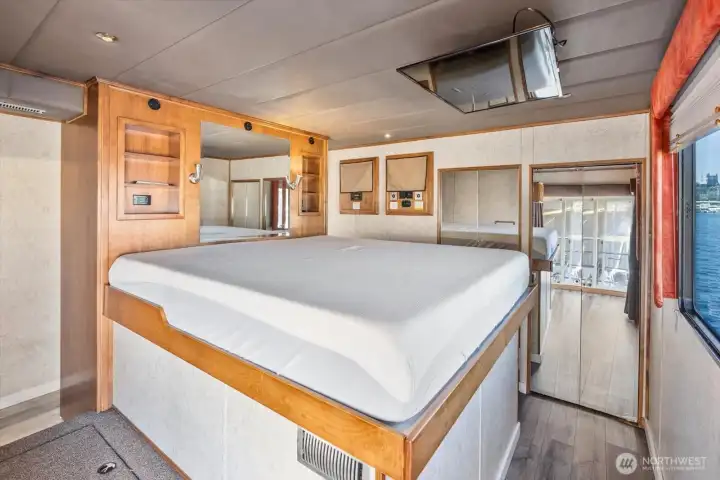 Primary suite is on the main level with walkin closet, stack laundry, large bath and nicely appointed... TV drops down at the foot of the king bed from the ceiling.