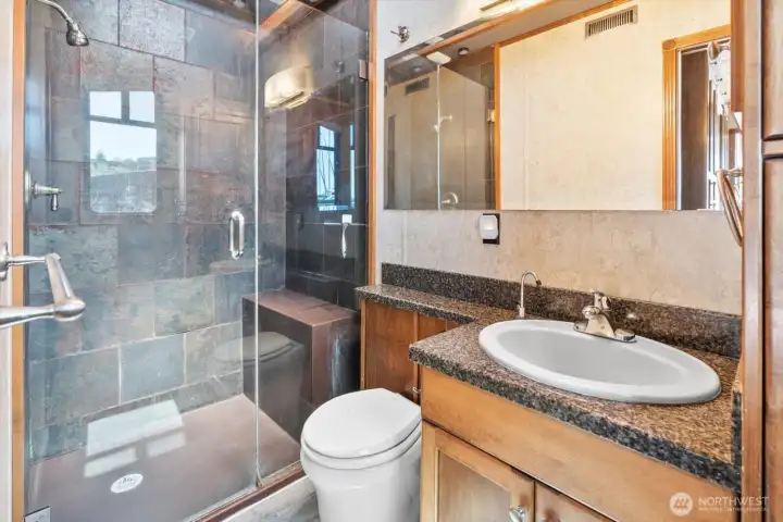 Three quarter bath off the primary suite on the main level.