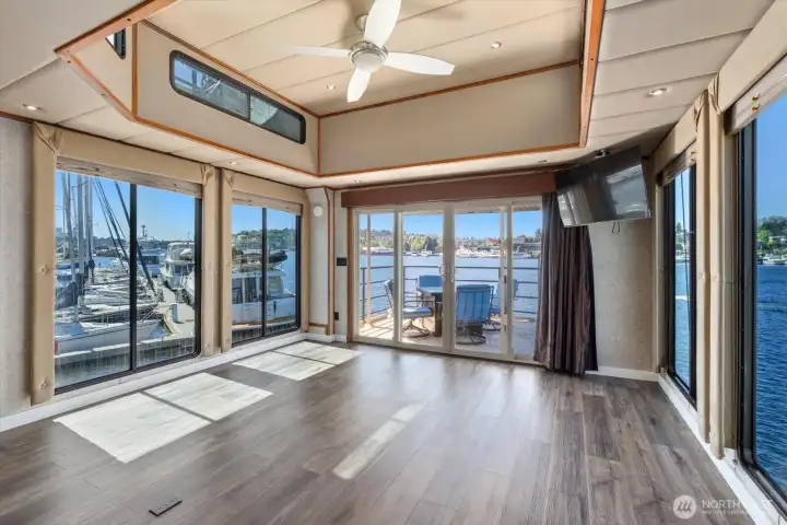 Bonus room is wrapped in windows to enjoy stunning views.  Remember you are allowed to do short-term rentals of 30 days or longer per King County code over water. Pets and rentals welcome.