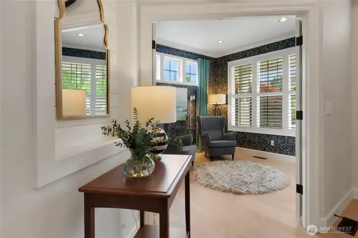 From the foyer, French doors open to the den/office.