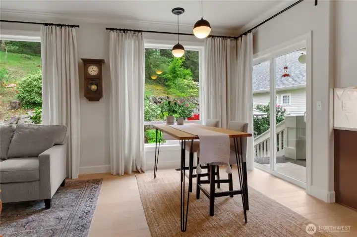 Abundant windows fill the walls with a slider door that steps out to the deck extending your entertainment space to the outdoors. An additional dining space for your casual meals.