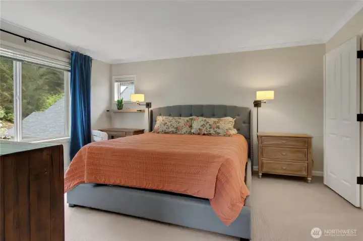 A generous primary bedroom is a wonderful personal retreat to unwind and relax after a long day.