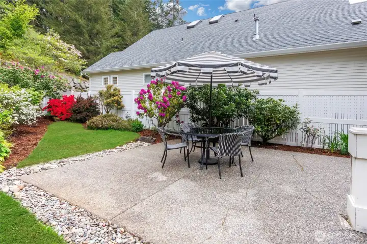 Enjoy the private patio surrounded by colorful landscape for summer fun gatherings.