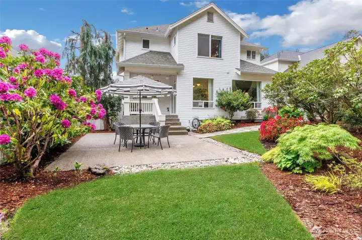 This beautiful yard has a park like setting, don't miss the darling covered back porch.