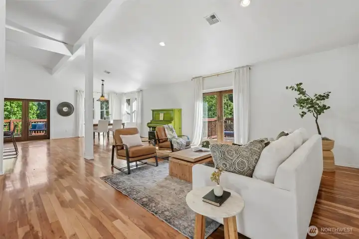 Living Room, vaulted ceilings, Skylights, Hardwood floors, french doors to deck