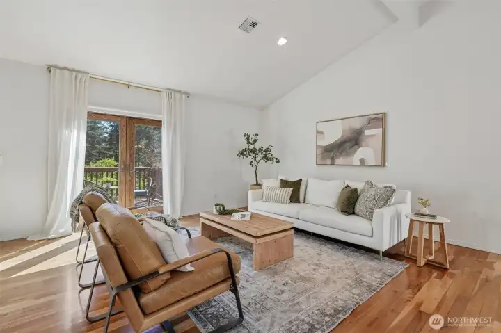 Living Room, vaulted ceilings, Skylights, Hardwood floors, french doors to deck