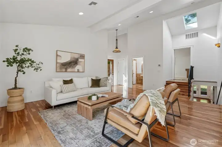 Living Room, vaulted ceilings, Skylights, Hardwood floors, french doors to deck