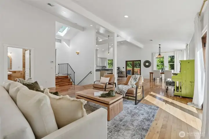 Living Room, vaulted ceilings, Skylights, Hardwood floors, french doors to deck